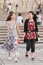 Cheerful girls hand in hand on a square, Xian, China